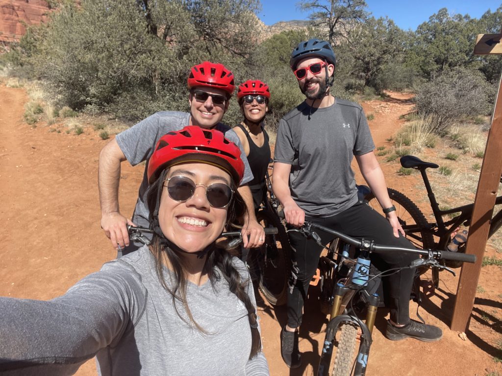 Four people mountain biking in the desert