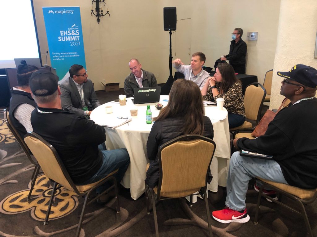 A conversation around a table at the Mapistry EHS&S Summit