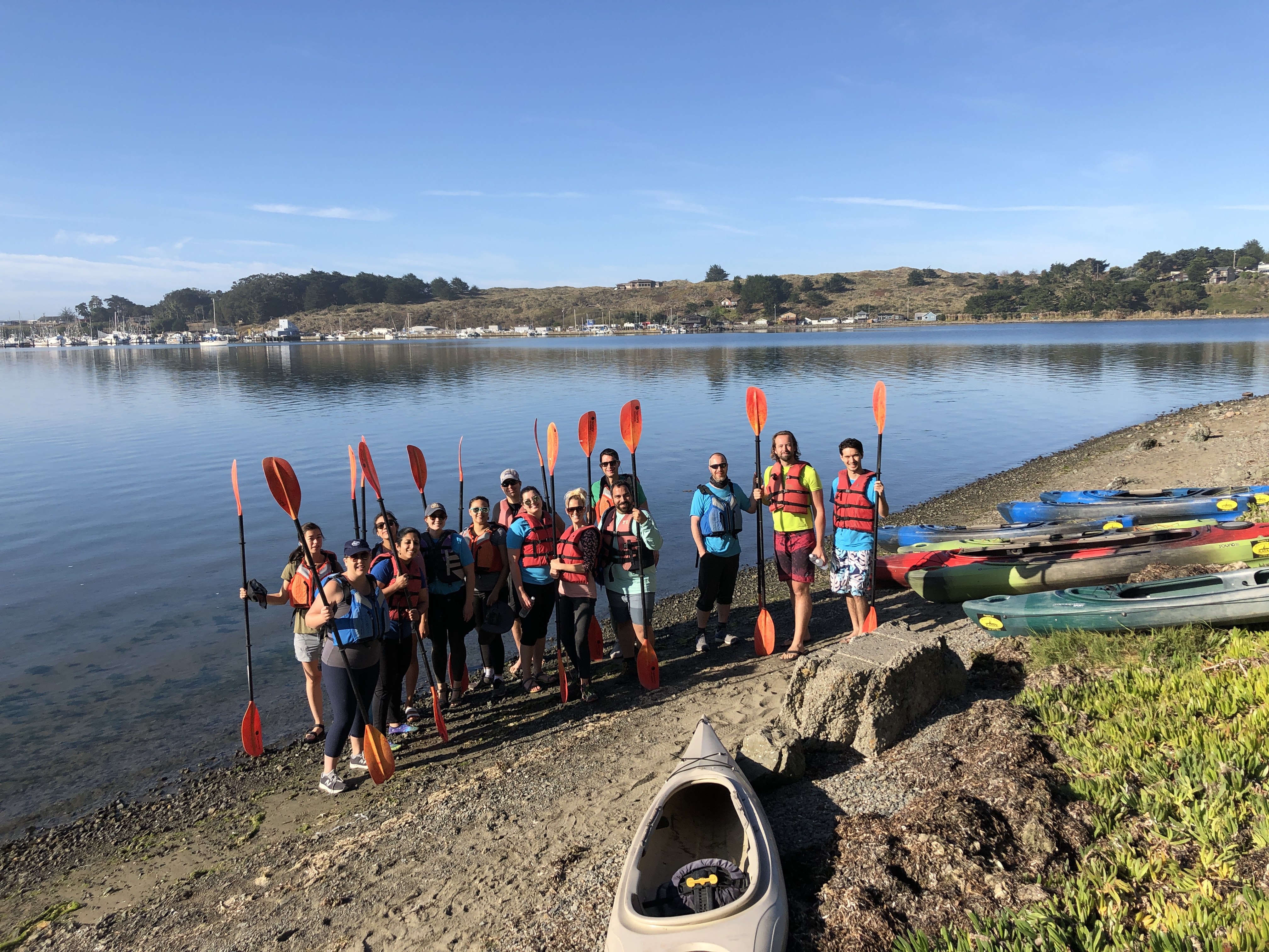 Group of people with kayak paddles